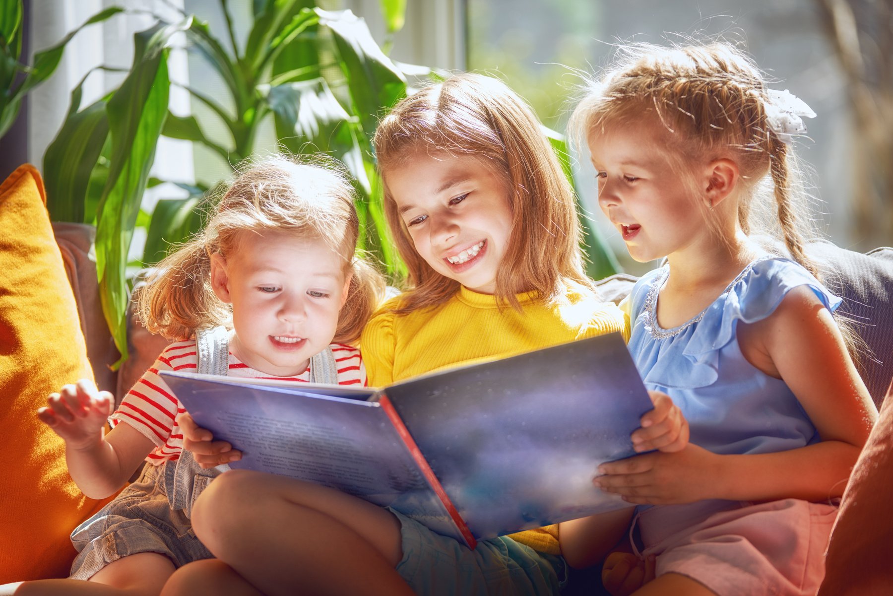 Mom and children reading a book